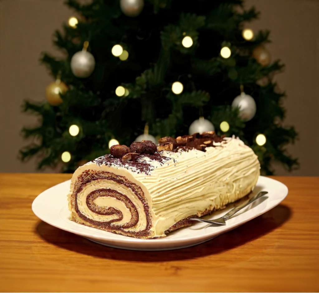 Bûche tiramisu Noël roulée, saupoudrée de cacao et décorée de grains de café